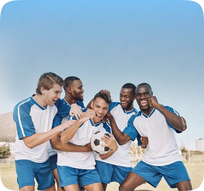 Football team huddled together with a ball